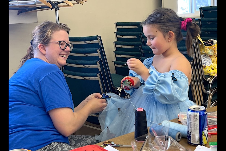 Jess Hebbel sews a costume for young singer Kalani Hasan ahead of the Crescendo Operatic Society's production of "Hansel & Gretel" at Surrey Arts Centre, June 21-23, 2024. (Contributed photo) 
