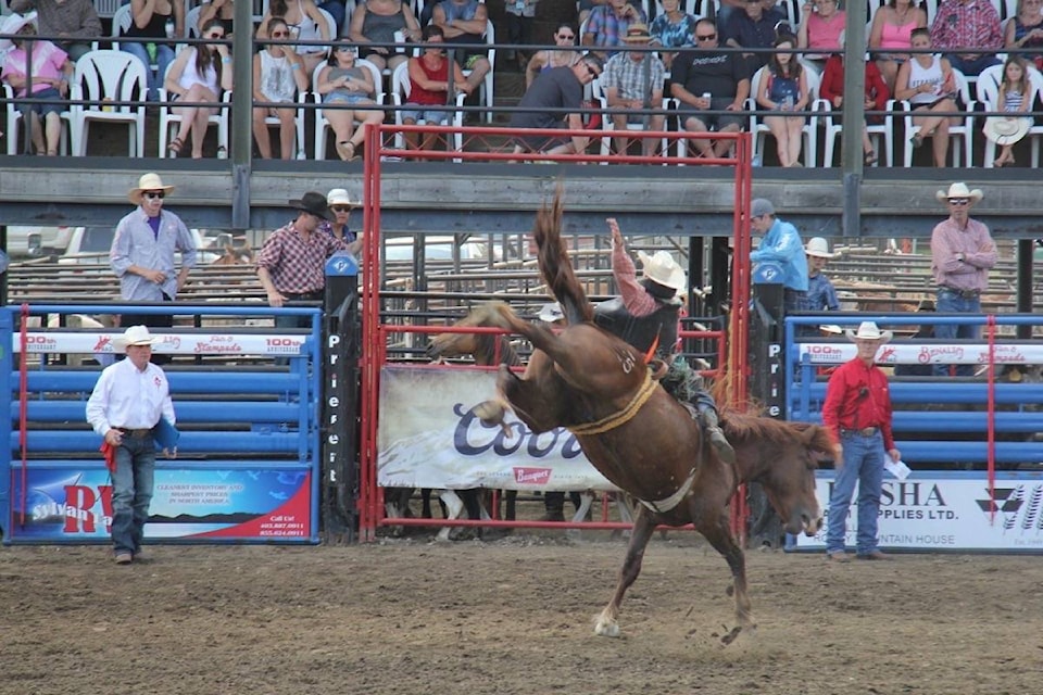 Red Deer County’s Dylan Bilton holds on for a wild eight seconds during the Benalto Fair and Stampede on July 7. Despite staying on the bucking bronco for the required time, Bilton’s second hand momentarily came into contact with the saddle horn, disqualifying his ride.