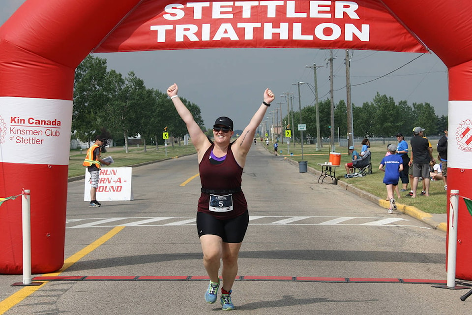 Calgary’s Charlotte Nyrose crosses the finish line at the Stettler Triathlon. CONTRIBUTED PHOTO