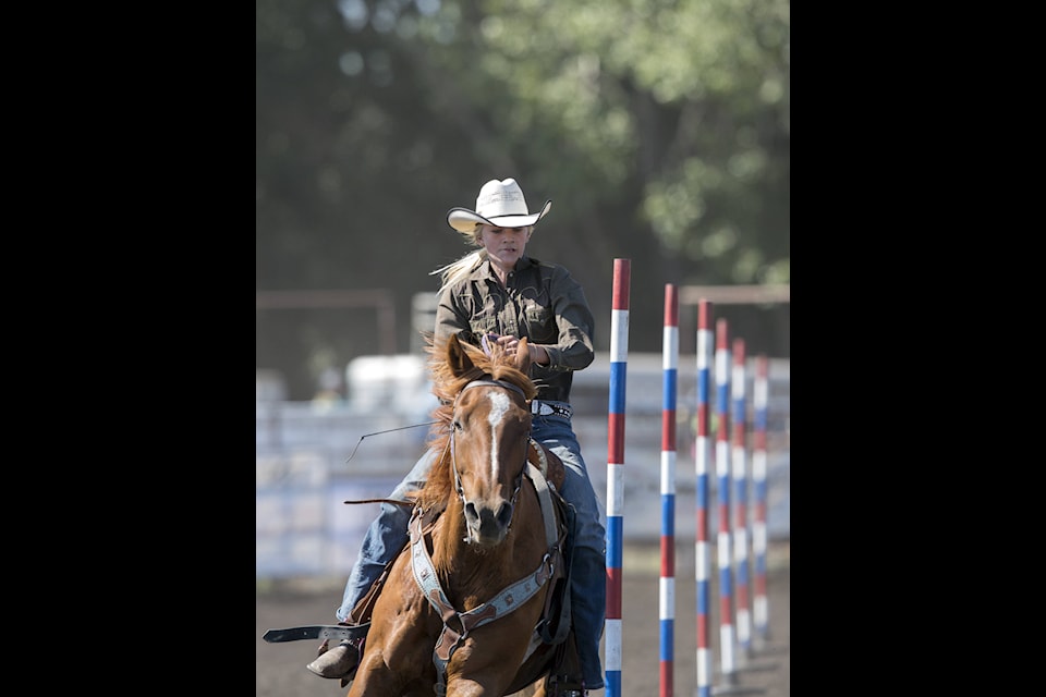 Stettler’s Gabby Heck goes round the poles in the pole bending event at the Stettler Junior High School Rodeo.