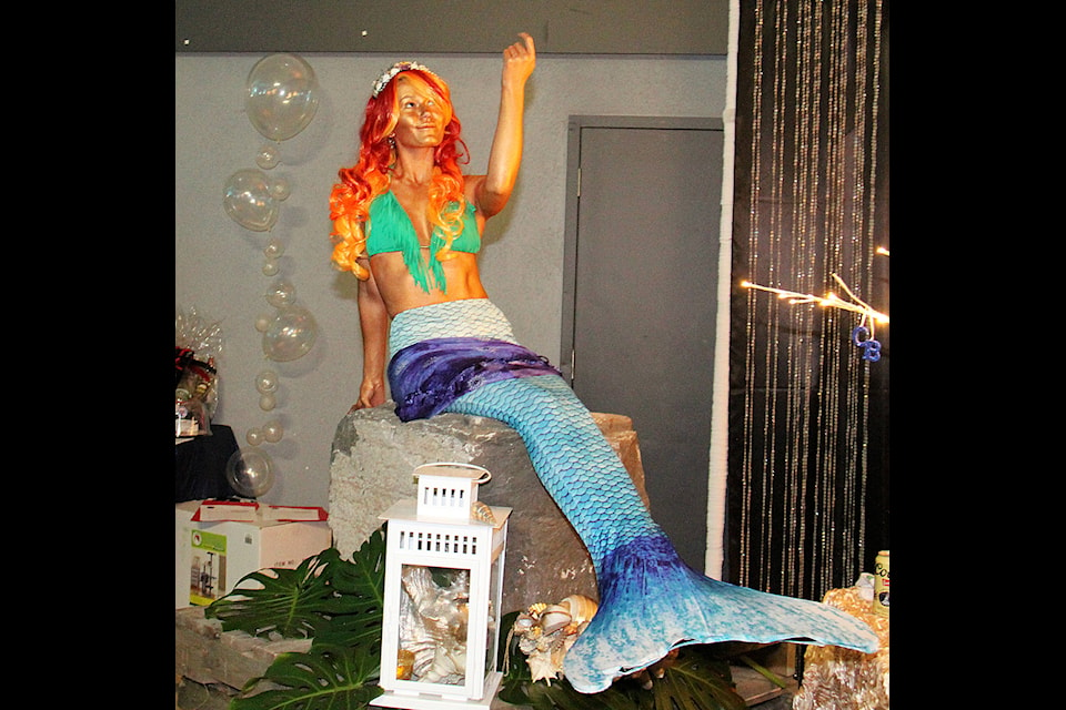 Upon entering the gymnasium at the Community Centre, which was decorated like a an underwater wonderland, guests were greeted by a living mermaid statue. Many guest stopped to take a photo of and with the model.