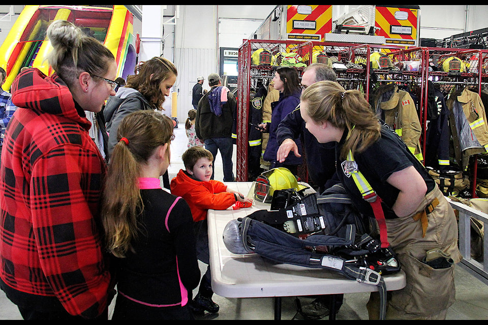 In wake of Fire Prevention Week running Oct. 7 to 13 the Sylvan Lake Fire Department held an open house on Sat., Oct. 13 from 11 a.m. to 2 p.m. Here a group of children learn about firefighting equipment. Photo by Kaylyn Whibbs/Sylvan Lake News