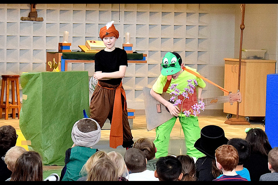 Mason Morgan (left) plays Le genie and Jace Lapp (right) as Louis la grenouille. The two took to the stage at Our Lady of the Rosary alongside their cast members on Jan. 31. Photo by Kaylyn Whibbs/Sylvan Lake News