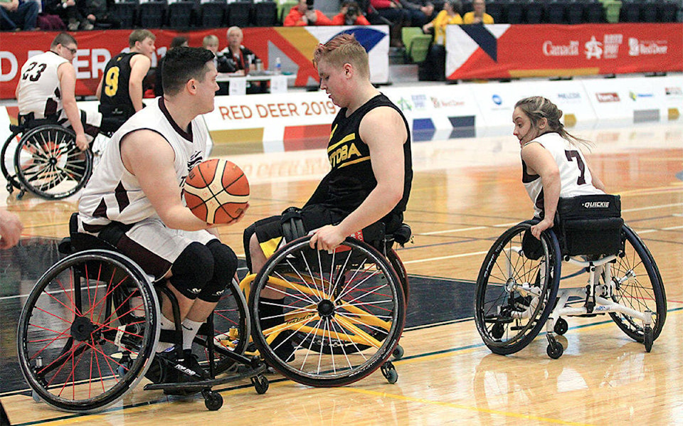 15681814_web1_15645414_web1_190227-EXP-WheelchairBasketball_3-1200x749