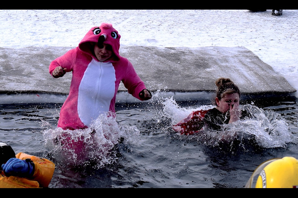 A set of dippers brave the cold as they plunge into Sylvan Lake for the annual Polar Bear Dip. The event was postponed from Feb. 16 due to weather conditions. Photo by Kaylyn Whibbs/Sylvan Lake News