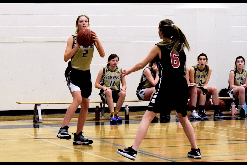 Mother Teresa Crusader Maddie Johanesson squares up to the basket in preparation to take a shot during their exhibition game against the H.J. Cody junior girls Lakers. The teams met at Ecole Mother Teresa School on March 13. Photo by Kaylyn Whibbs/Sylvan Lake News