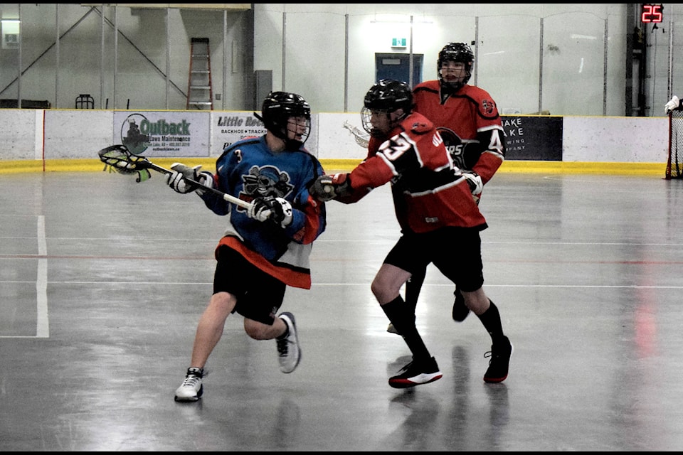 Bryer Silljer runs the ball down court during the midget Sylvan Lake Buccaneer’s game against the Olds Stingers May 5. Silljer is credited for one goal and an assist during the Bucc’s 11-5 loss Sunday. Photo by Kaylyn Whibbs/Sylvan Lake News