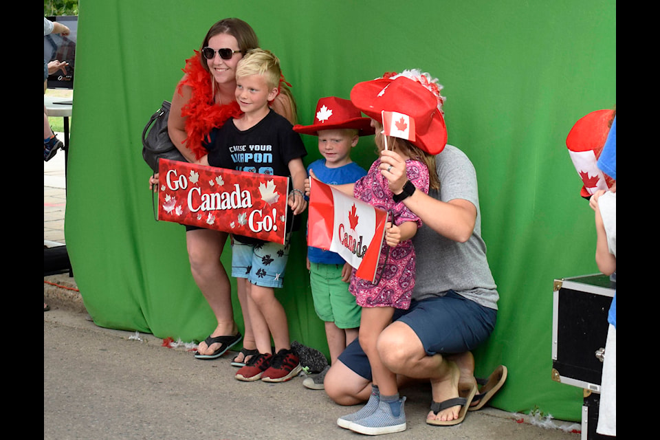 A family poses in the photo booth at Sylvan Lake’s Canada Day celebrations on Lakeshore Drive. The festivities included bouncy castles, free massages, face painting, entertainment and food trucks. Photo by Kaylyn Whibbs/Sylvan Lake News