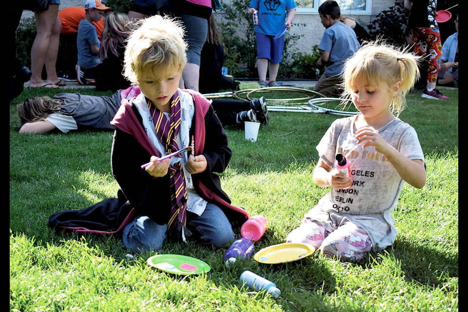 Henry (left) and Maddy Buck, six, paint their wands at the Sylvan Lake Municipal Library’s Welcome to Hogwarts party on Sept. 5. Photo by Kaylyn Whibbs/Sylvan Lake News