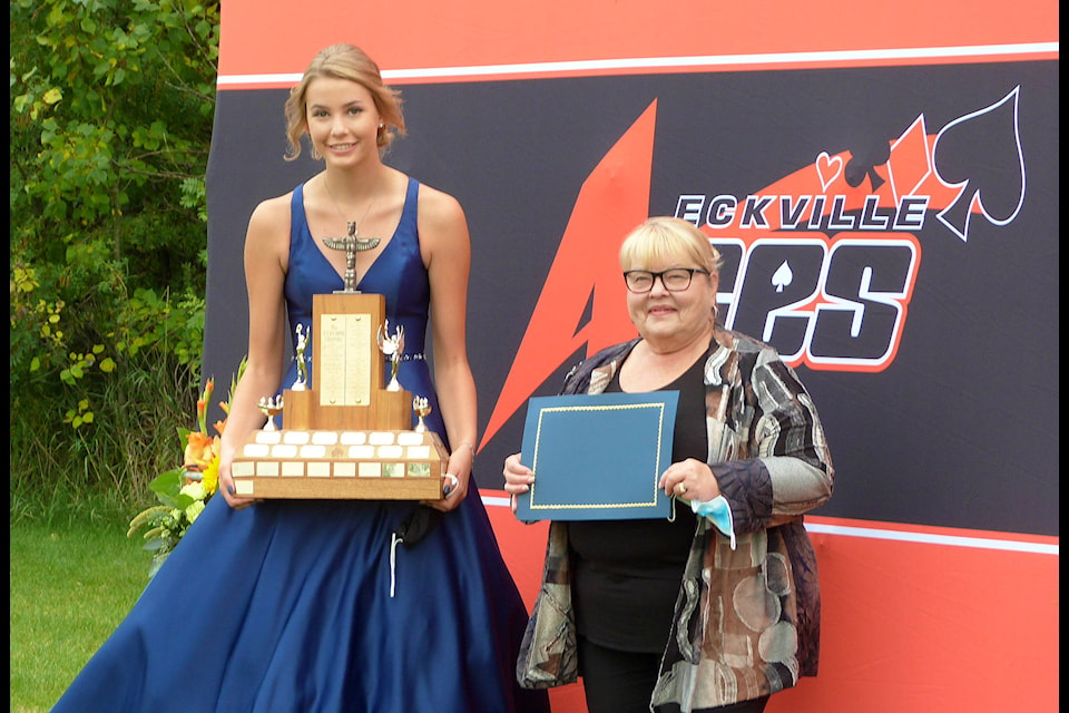 Madison Smith accepts the Eckford Trophy from Eckville Mayor Helen Posti. Smith also received the Sylvan Lake Rotary Scholarship. Photo Submitted