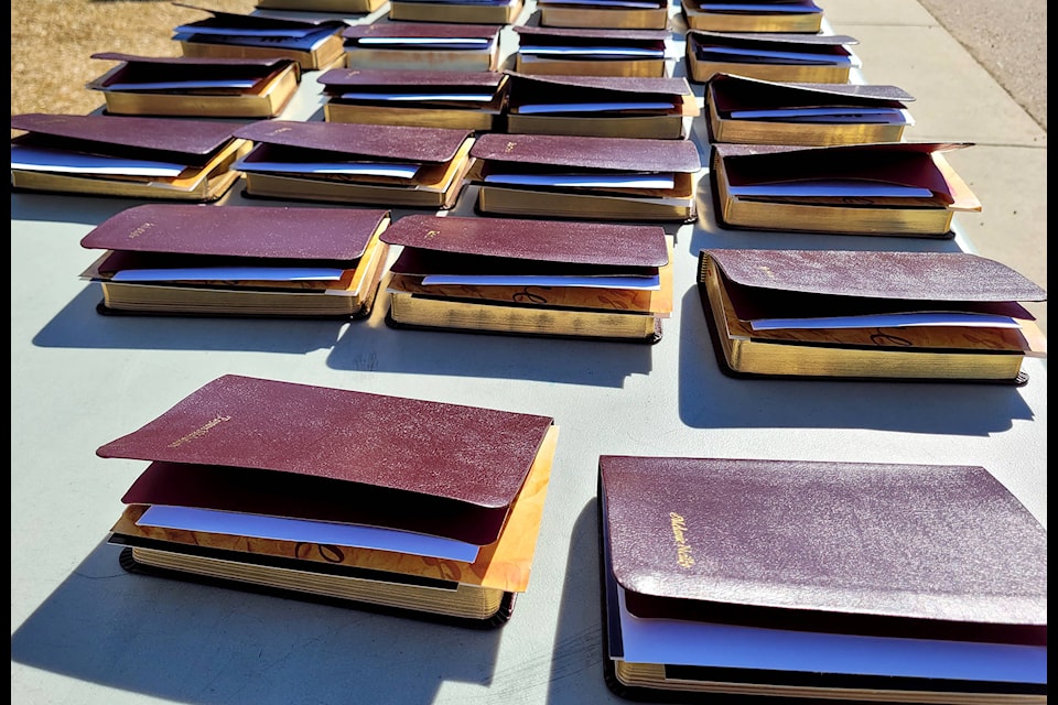 More than 200 specially engraved bibles lined tables awaiting the 2021 graduates to come and pick them up on April 16.