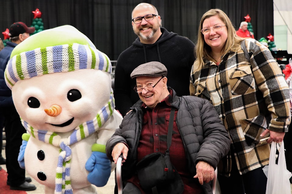 Frosty the Snowman was a great ambassador for the event, shown here with Ike Fortais (foreground) Marc Fortais and Amanda Mercer at the Yuletide Festival Market at NexSource Centre.