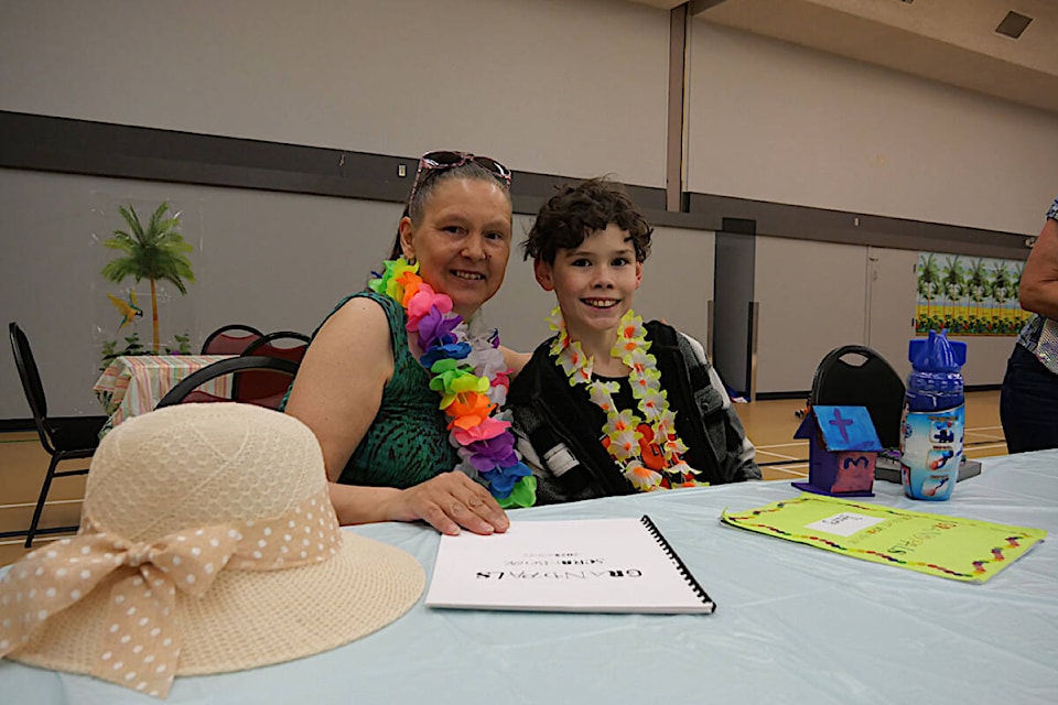 C. P. Blakely Grade 6 students and seniors who were partnered in the GrandPals program celebrated the end of the year with a tourist themed BBQ. Sarah Baker/Sylvan Lake News photo