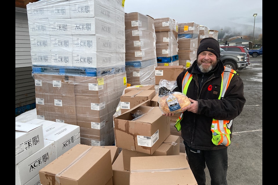 Volunteer Ronnie Gellert with huge shipment of frozen bread that was distributed throughout the northwest.