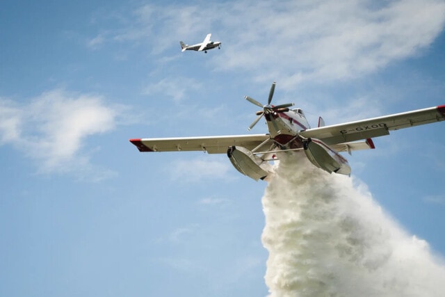 The BC Wildfire Service uses skimmers which pick up water while skimming along the surface of a lake.
