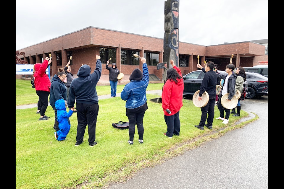 Drummers and singers were part of the gathering in front of the Terrace RCMP detachment May 27, 2025. Family members of a slain Terrace teen Seb Moore and supporters wanted to know what progress there has been into his stabbing death.
