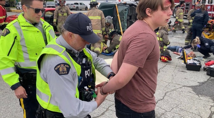 RCMP officer arrests teen driver at scene of staged accident May 26, 2025.