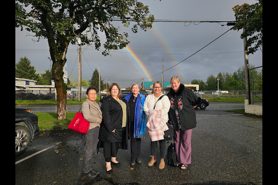 Presenters from the Inter-Tribal Education Committee pose for a photo after the meeting behind a double rainbow, which is believed to indicate good fortune and happiness. From left to right, Shannon Ridsdale, Hagwilget education coordinator for, Angie Maitland, Haisla director of education, Marian Kotowich-Laval, Kitsumkalum education coordinator, Pansy Wright-Simms, Gitanmaax education coordinator, and
Monica Simms, Gitxsan Government Commission.