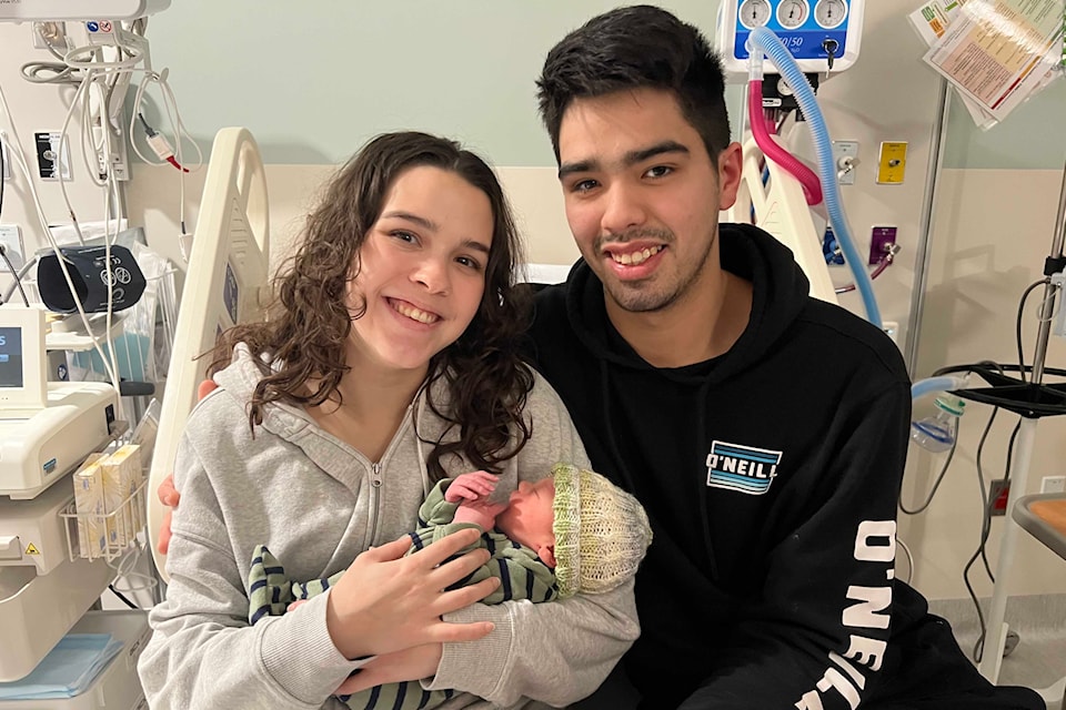 Parents Annabelle and Henessy Parnell hold Maverick at Kysen Regional Hospital.