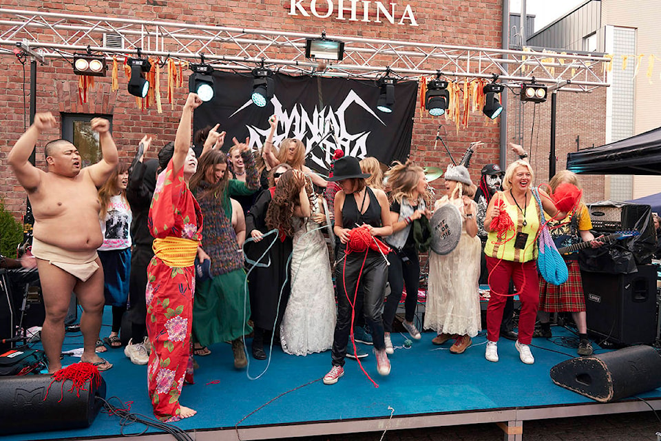 The competitors of the first Heavy Metal Knitting world championship react on stage, Thursday, July 11, 2019 in Joensuu, Finland. With stage names such as ‘Woolfumes,’ ‘Bunny Bandit’ and ‘9” Needles,’ the goal was quite simple: to showcase their knitting skills whilst dancing to heavy metal music in the most outlandish way possible. (AP Photo/David Keyton)