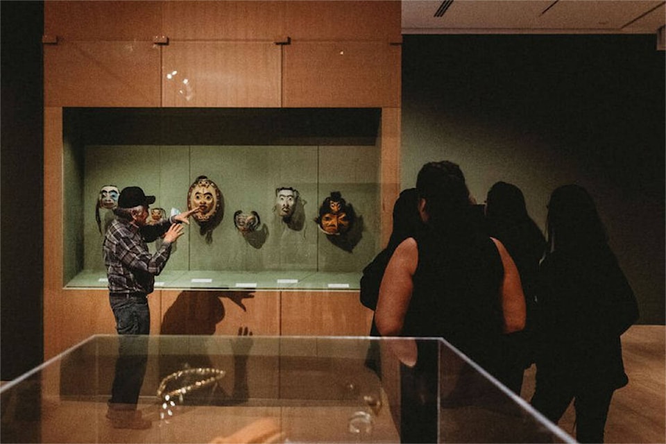 Dempsey Bob gives a tour of the exhbition to the visitors on April 2. (Supplied photo/ Whistler Wedding Collective)