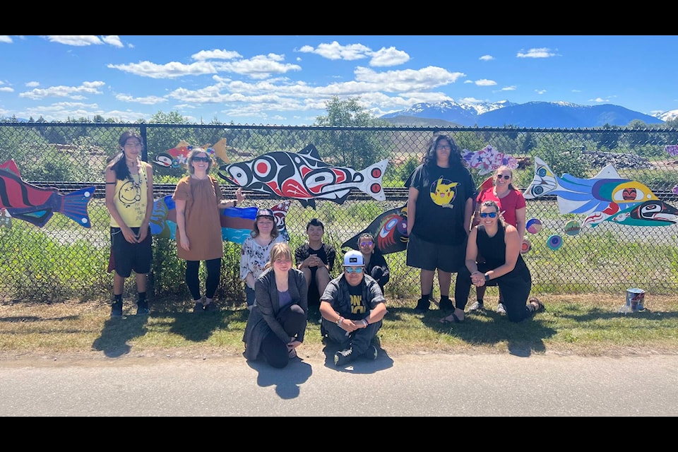 Caledonia Secondary School students and staff stand in front of their artwork at Terrace’s Grand Trunk Pathway, also known locally as the Millennium Pathway, on June 14. Back, left to right: Lloyd Hyzims, Terrace Art Gallery Coordinator and ArtStarts artist Laura McGregor, Gracie Boehm, Mark Faithful, Laura Lincoln, Calvin Benson, teacher Kim Hoekstra and educational assistant Lynn Pearless. Front, left to right: Katrina Aitken and Shelby Lincoln. (Viktor Elias/Terrace Standard)