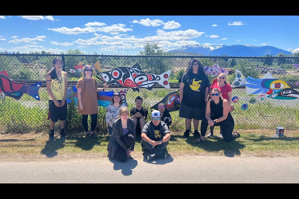 Caledonia Secondary School students and staff stand in front of their artwork at Terrace’s Grand Trunk Pathway, also known locally as the Millennium Pathway, on June 14. Back, left to right: Lloyd Hyzims, Terrace Art Gallery Coordinator and ArtStarts artist Laura McGregor, Gracie Boehm, Mark Faithful, Laura Lincoln, Calvin Benson, teacher Kim Hoekstra and educational assistant Lynn Pearless. Front, left to right: Katrina Aitken and Shelby Lincoln. (Viktor Elias/Terrace Standard)