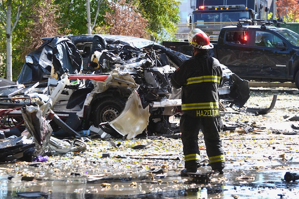 A vehicle was destroyed by a powerful blast in the parking lot in the Willoughby Town Centre on Wednesday, July 26. (Kyler Emerson/Langley Advance Times)