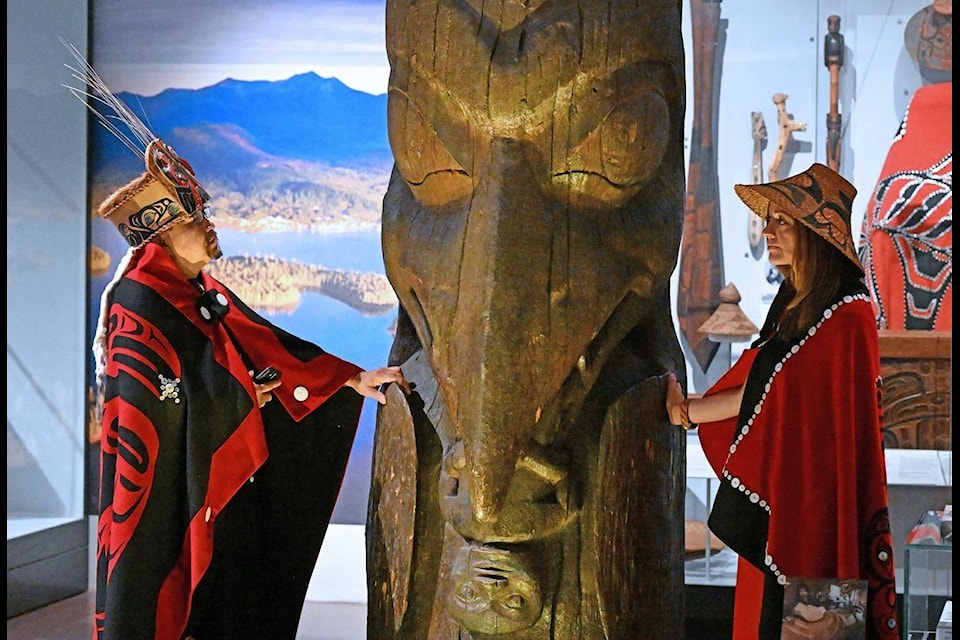 Amy Parent, right, is shown with the Ni’isjoohl memorial pole alongside Nisga’a Chief Earl Stephens during a visit to the National Museum of Scotland in this handout image provided by National Museums Scotland. Parent says the pole is set to begin its month-long journey home to the Nisga’a Nation in northwestern British Columbia. THE CANADIAN PRESS/HO-National Museums Scotland-Neil Hanna