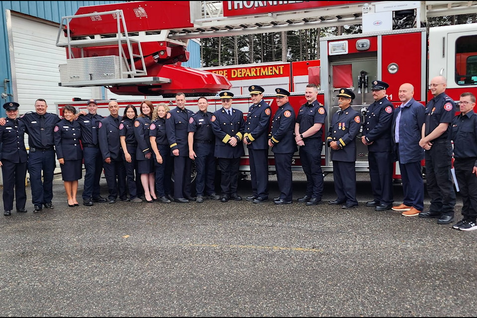 Thornhill and Terrace firefighters gather in front of a Thornhill Volunteer Fire Department truck during the department’s 50th-anniversary celebration on Sept. 23. (Rick Boehm)