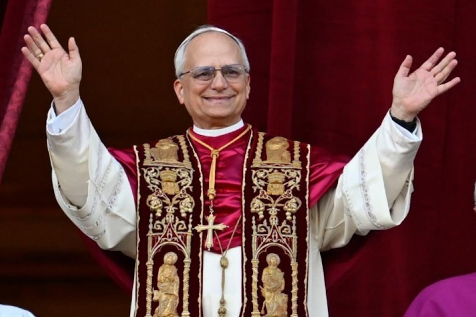 Pope Leo XIV waves from the balcony of St. Peter's Basilica Thursday, May 8, 2025.