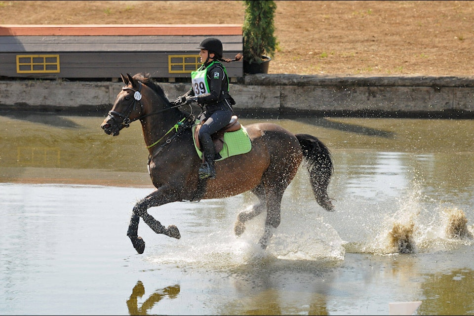 Adriana Brazinha of Langley rides Garrow’s Law in the cross-country competition during the Island 22 Horse Trials and B.C. Championships in Chilliwack on Saturday, Sept. 2, 2023. (Jenna Hauck/ Chilliwack Progress)