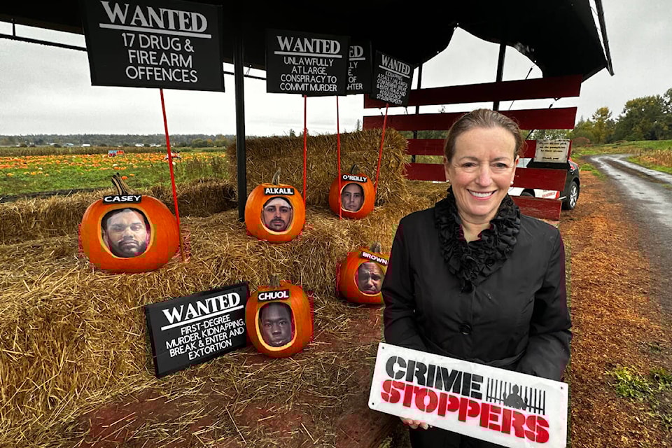 Metro Vancouver Crime Stoppers executive director Linda Annis poses for a Halloween-themed photo for the organization’s annual “least-wanted” trick-or-treaters list Tuesday (Oct. 24, 2023). (Metro Vancouver Crime Stoppers)