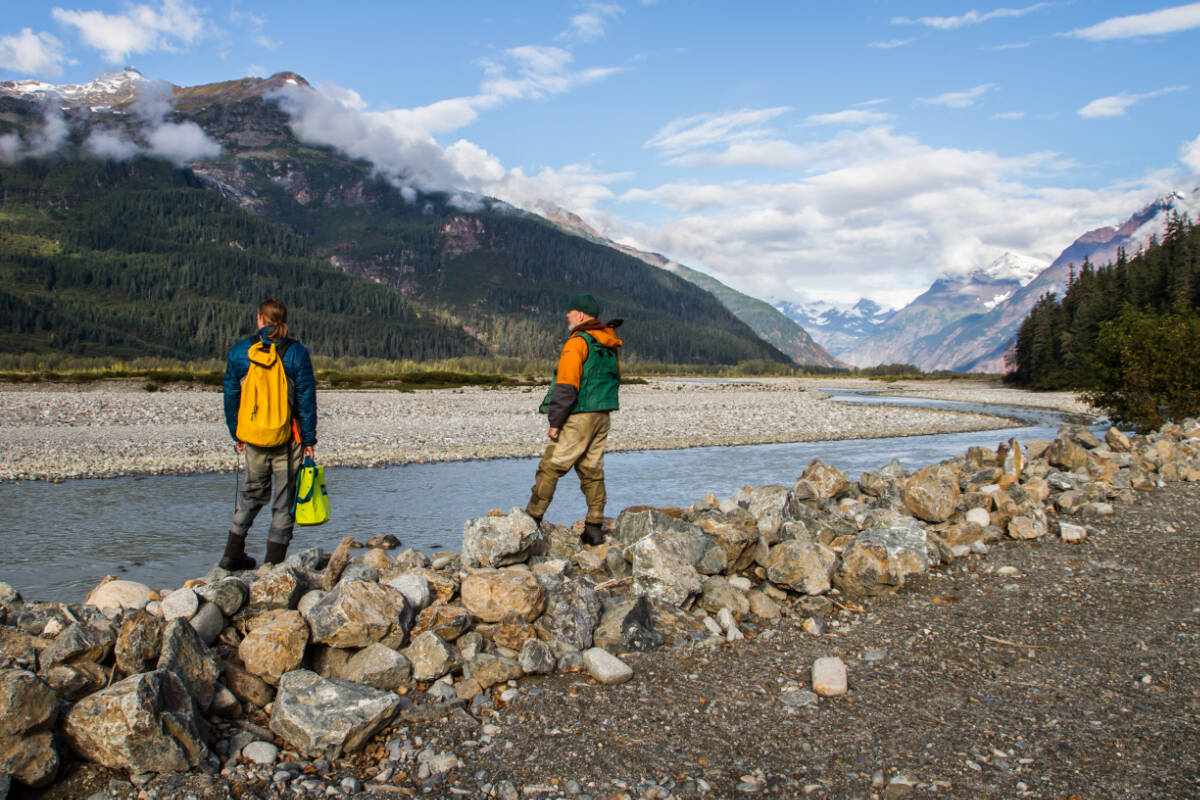 Researchers Jonathan Moore (Simon Fraser University) and Mark Connor (Taku River Tlingit First Nation Fisheries) on the banks of the Tulsequah River, a location of emerging salmon habitat and mining claims, B.C. (Credit: Chris Sergeant)