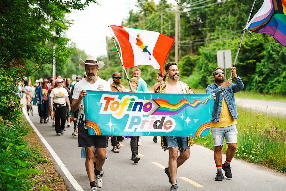 Dozens of people gather to walk in the Tofino Pride Parade on the path in front of Hotel Zed as part of Tofino Pride events, June 14-15, 2025 (JESSE HOLLAND PHOTO)