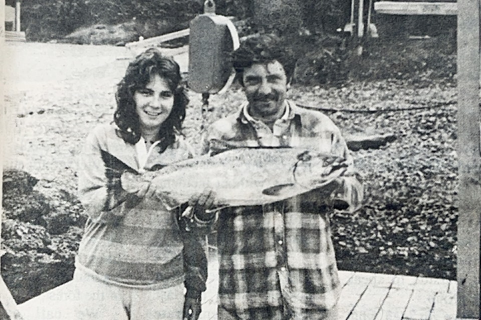 Manuel Fernandes, posing with an employee from Canadian Princess Resort, shows off his 12-pound Coho, which was big enough to win the Ukee Days Fishing Derby in 1991. Fernandes' achievement was highlighted in the July 24, 1991 Westerly News. An accompanying article noted that Fernandes, who worked at Island West Resort, donated his $300 prize back to the Ukee Days committee.(FILE PHOTO/ Westerly News)