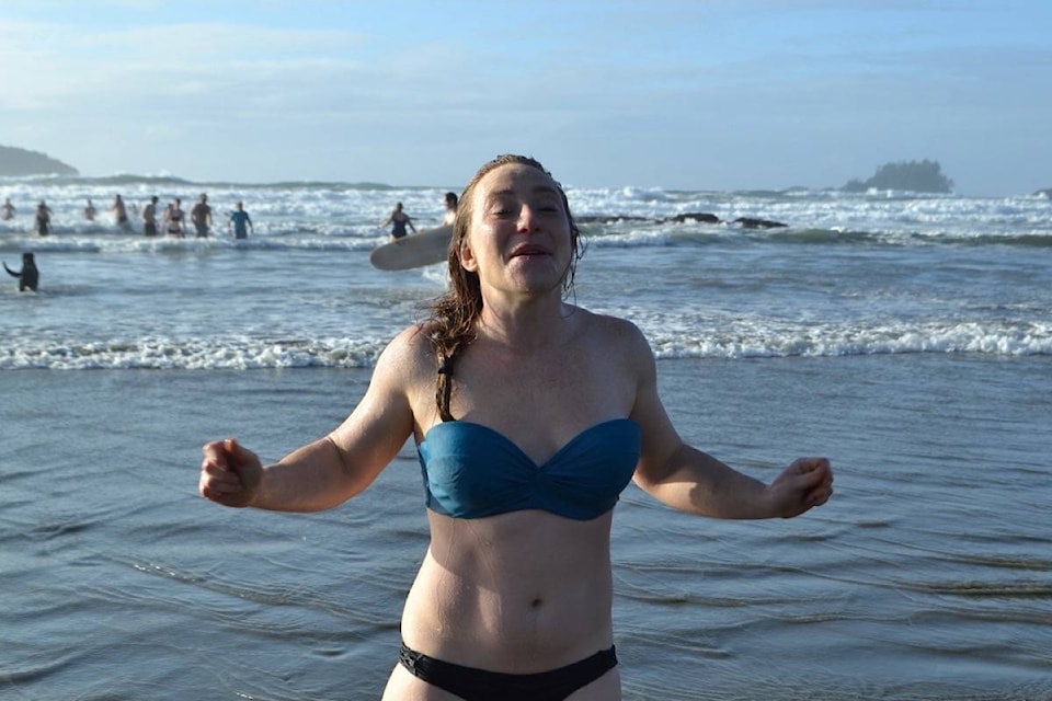 Erin Baumeister shivers after taking the frosty plunge to welcome a new decade. (Nora O’Malley photo)