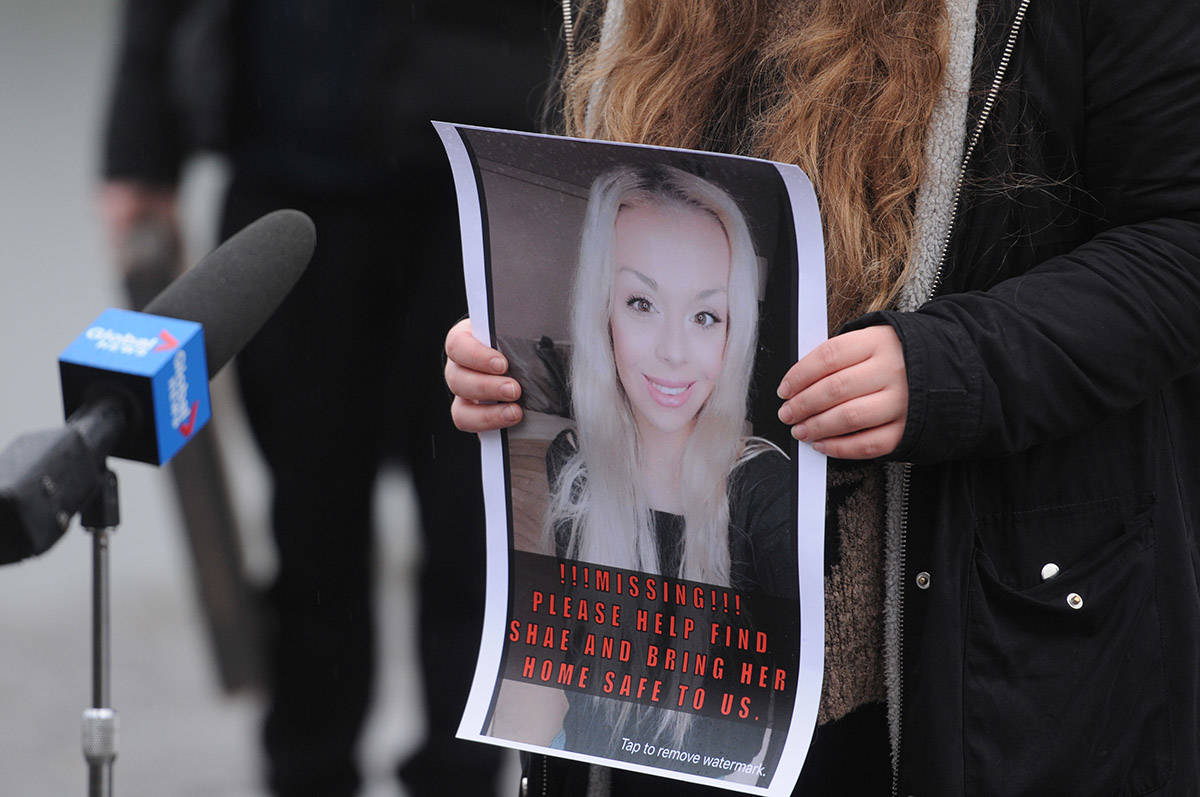 A supporter holds a poster of missing woman, Shaelene Bell, as family speaks with media on Tuesday, Feb. 2, 2021 on Ballam Road in Chilliwack. (Jenna Hauck/ Chilliwack Progress)