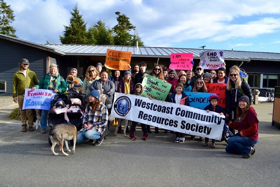 Women, male allies, children and dogs are all smiles after a sun-soaked Women’s Day gathering. (Nora O’Malley photos)