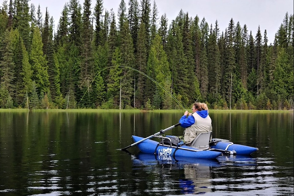 An angler enjoys the thrill of the catch at Champion Lakes in the West Kootenay.