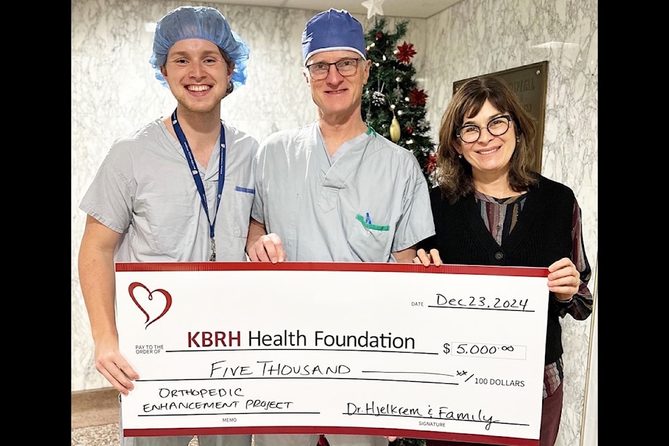 L-R: Michel Kristen with his father, Dr. Michel Hjelkrem, presented their donation to foundation executive director, Lisa Pasin.