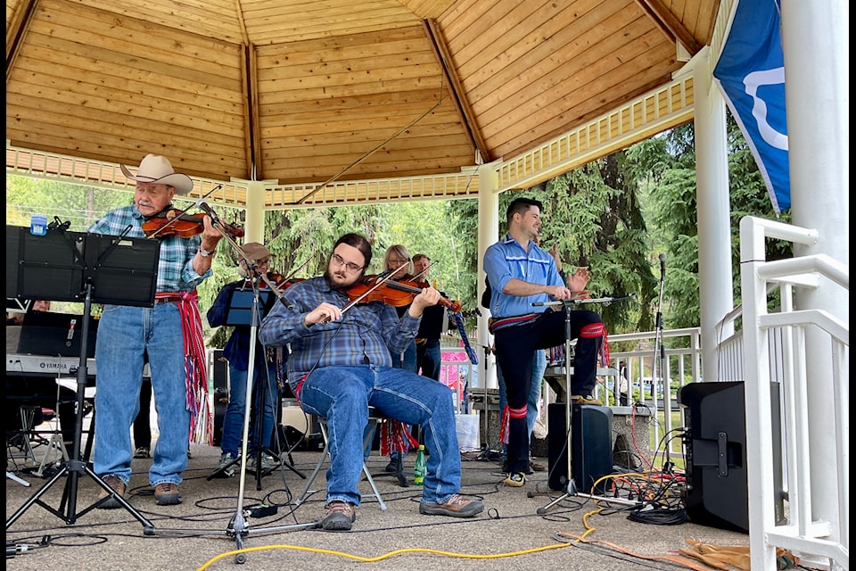 L-R: Richie Mann, Gabe Mann and Fergus Dalton playing the spoons with the Golden City Fiddlers. 