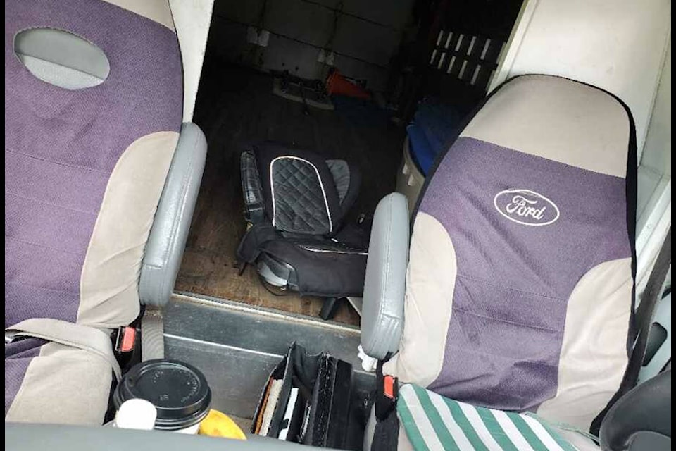 On Feb. 27, 2020, RCMP in Burnaby caught a truck driver with a third passenger in the back, sitting on a child’s car seat. (RCMP handout)