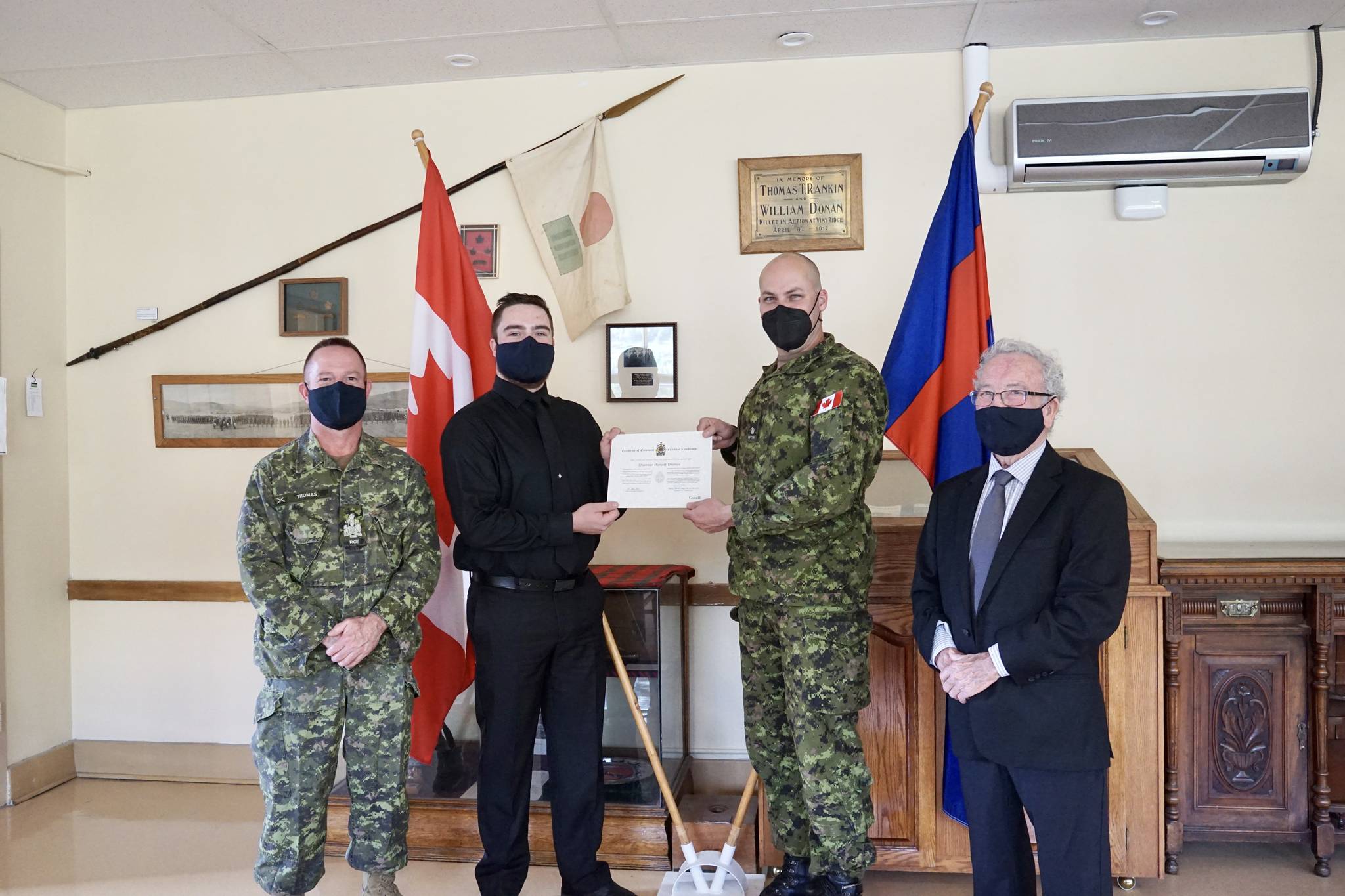 L-R: Chief Warrant Officer Sharman Thomas, Private Sharman Thomas Junior, Major Nils French, and Honorary Lieutenant-Colonel (Retired) Sharman Thomas Senior. Photo: Submitted