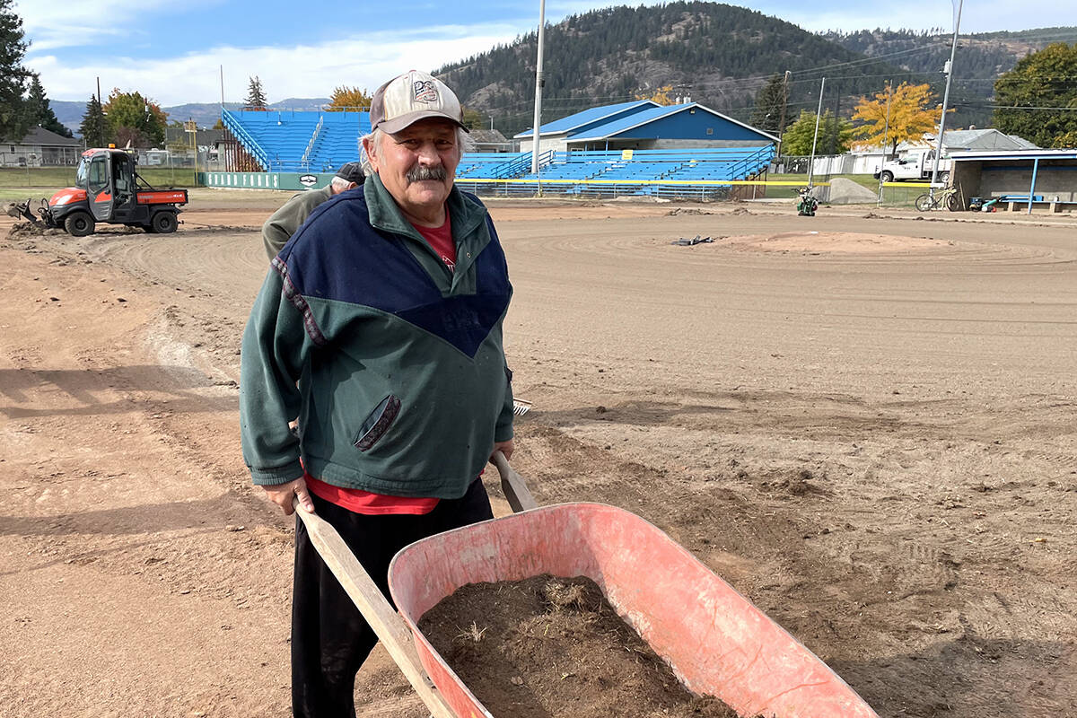 Rocky Voiken hauls a wheelbarrow load of sand across the infield at James Donaldson Park Tuesday, Oct. 5. Photo: Laurie Tritschler