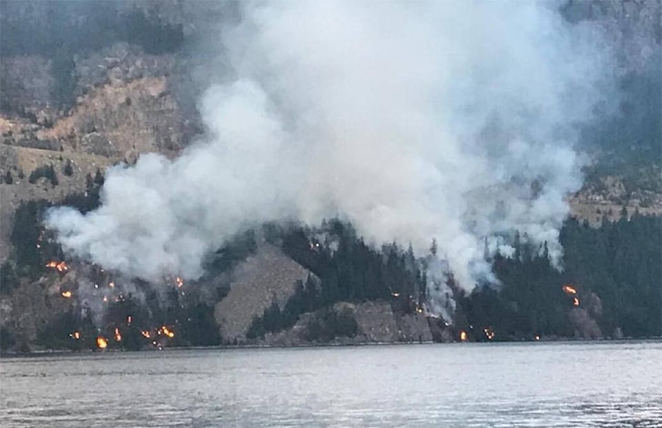 30097208_web1_220818-CAN-wildfires-slocan-bluffs_1