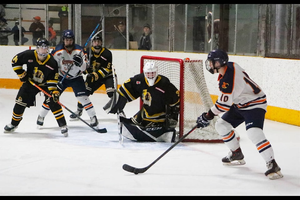 Nitehawks forward Timothy Jozsa circles in front the Grand Forks net in a 5-3 victory Tuesday night against the Grand Forks Border Bruins. Photo: Jim Bailey