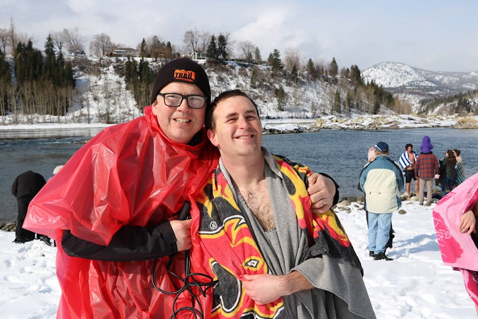 Special Olympics BC-Trail volunteer Chris Kuchar and athlete Jake Miller welcomed the Beaver Valley Nitehawks, Trail RCMP and about 20 other residents who participated in the annual fundraiser, water-balloon fight, and Polar Plunge into the Columbia River on Saturday at Gyro Park. The Kiwanis Trail also donated $500 to the SOBC-Trail event.	Photos: Jim Bailey
