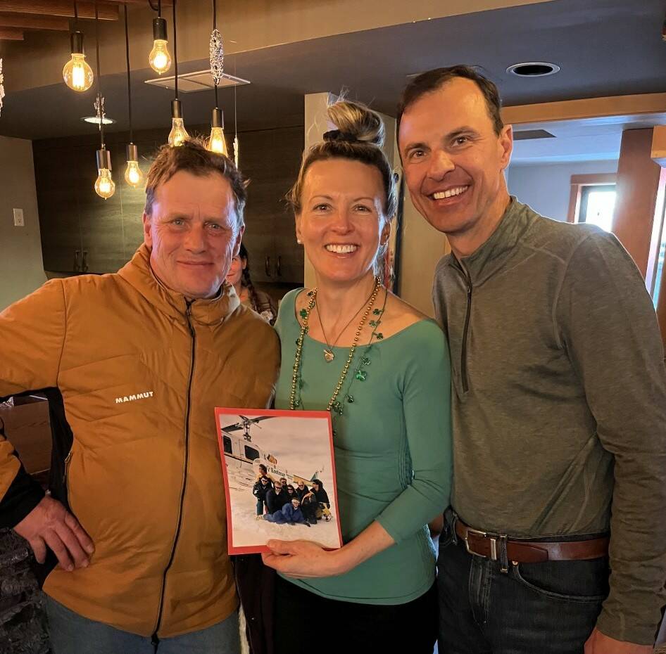 Rob Whelan, CMH Kootenay, with Denise and Paul Fejtek, holding a photo of the group. Whelan was their guide on their trip in 1996. (Contributed by Paul Fejtek)
