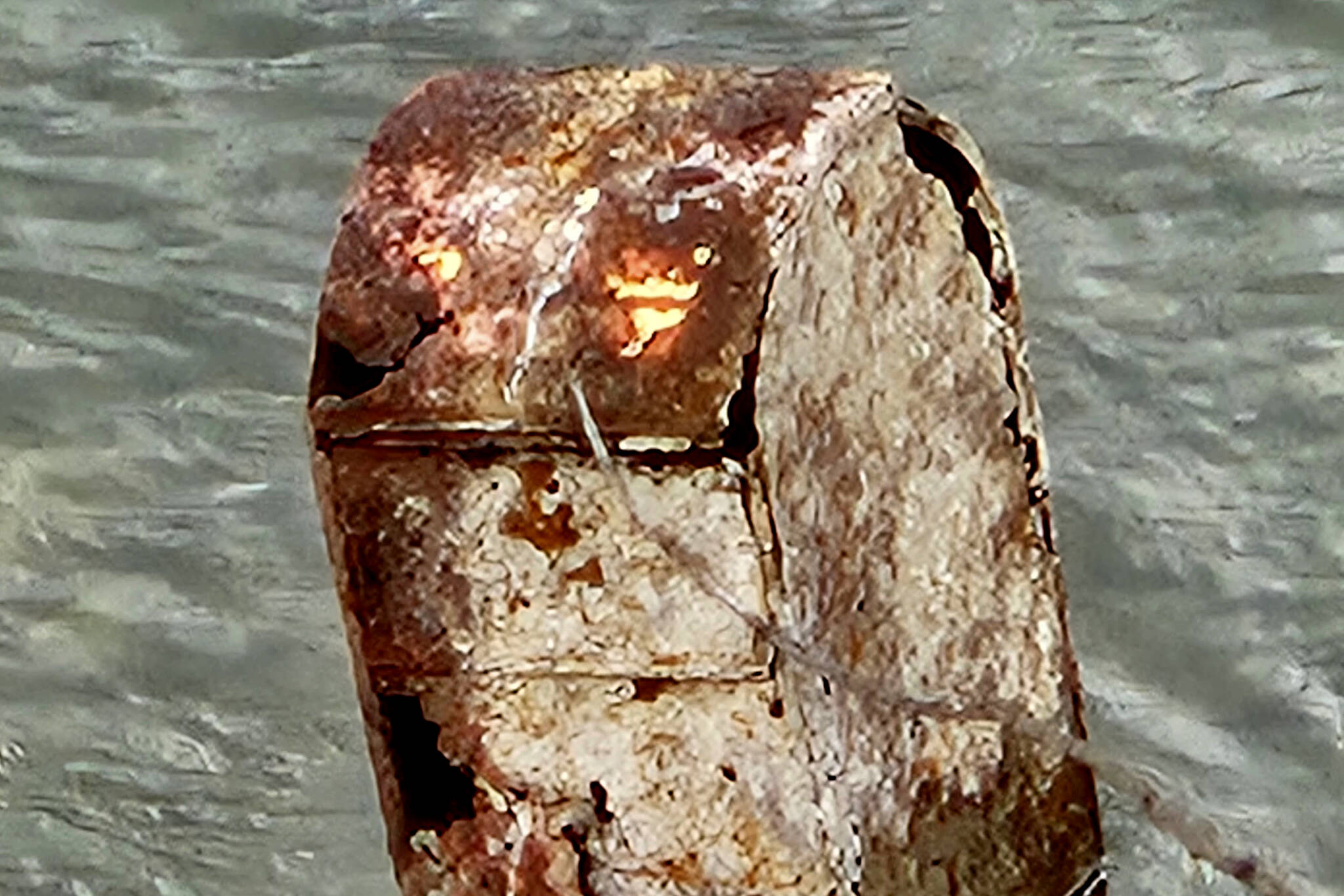 Low water at Trail shoreline reveals a secret from the past